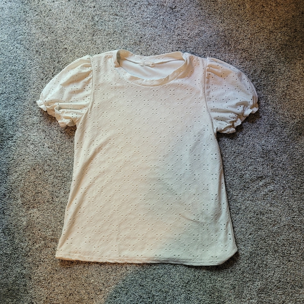 White eyelet ruffle sleeved blouse